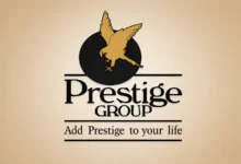 Prestige Group logo representing Prestige Estates as the company reports a 19% decline in Q1 profit and announces a new residential project in Thane.