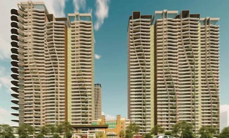 NBCC sells 111 residential flats in Noida through an e-auction, featuring apartment buildings and a residential property development.